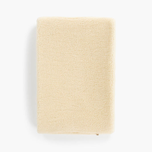 Lagen i 100% børstet merinould til babyseng 60x120 cm